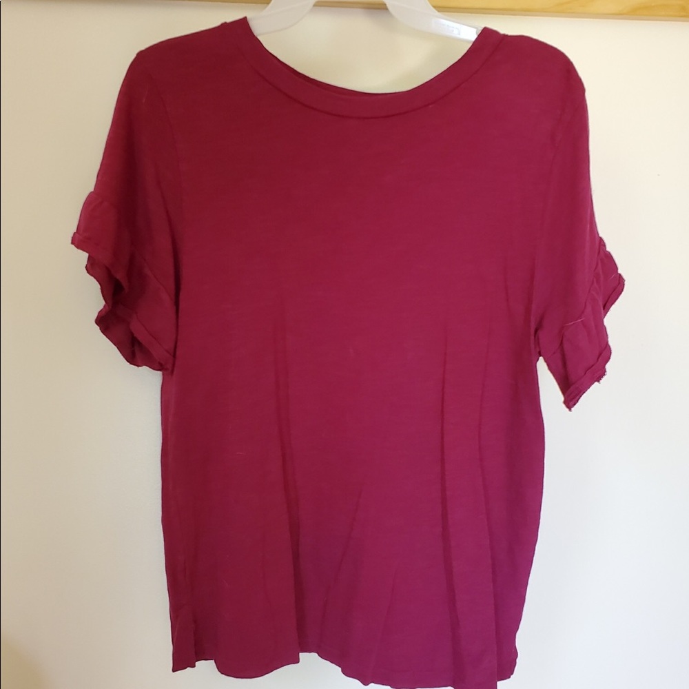 I’m selling a maroon/purple short sleeved shirt!